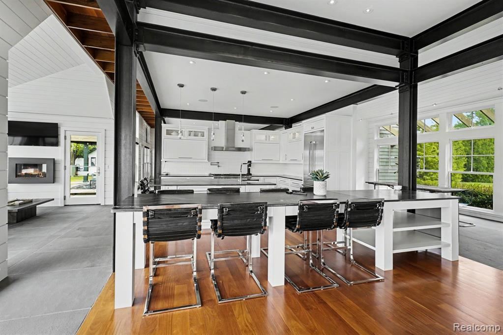 Kitchen with a large island, breakfast bar and built-in refrigerator