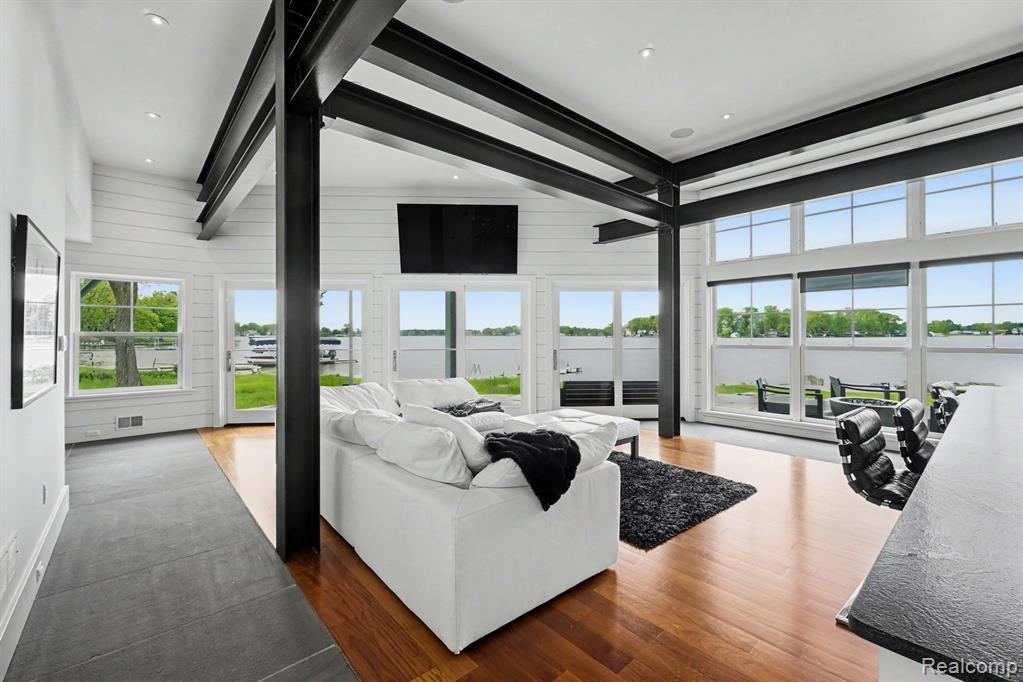 Open living area with lake views through a wall of windows