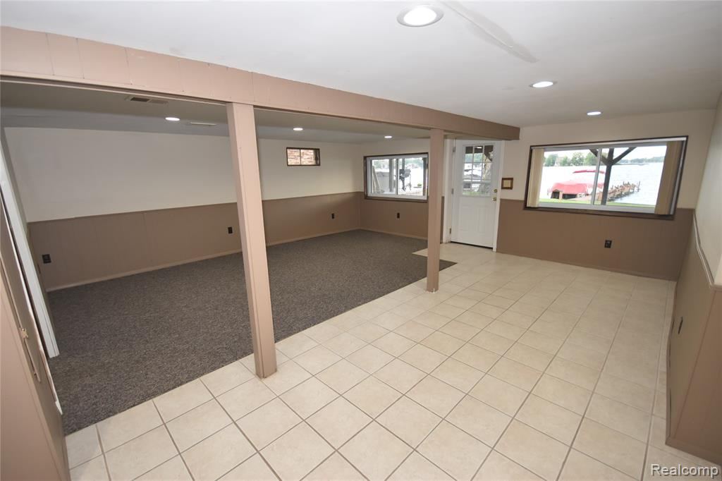 Lower-level family room with lake-facing windows